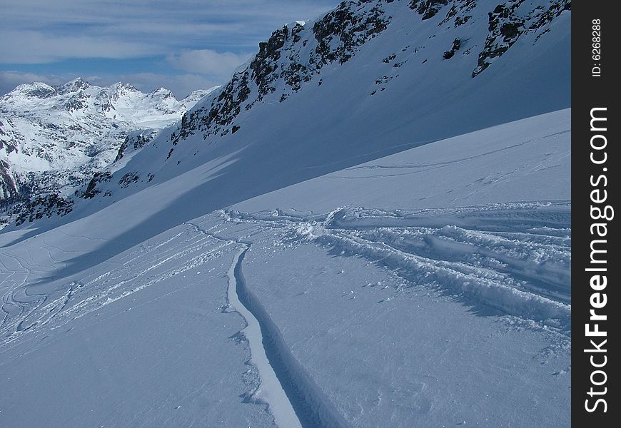Ski traks on the snow, Alps mountains