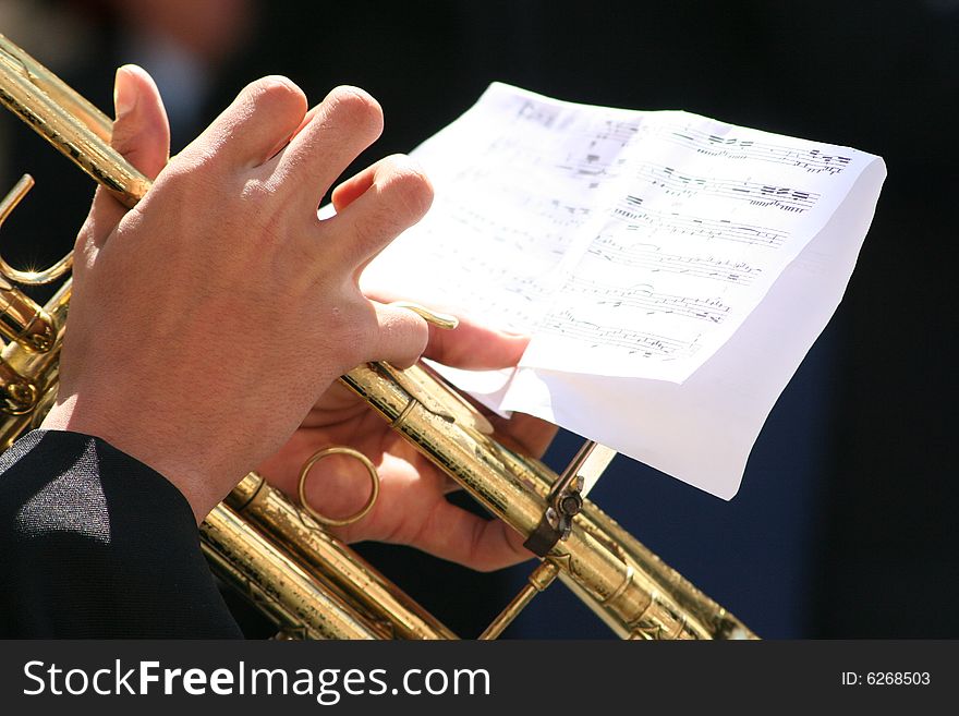 Hands of a trumpet player palying some tunes. Hands of a trumpet player palying some tunes