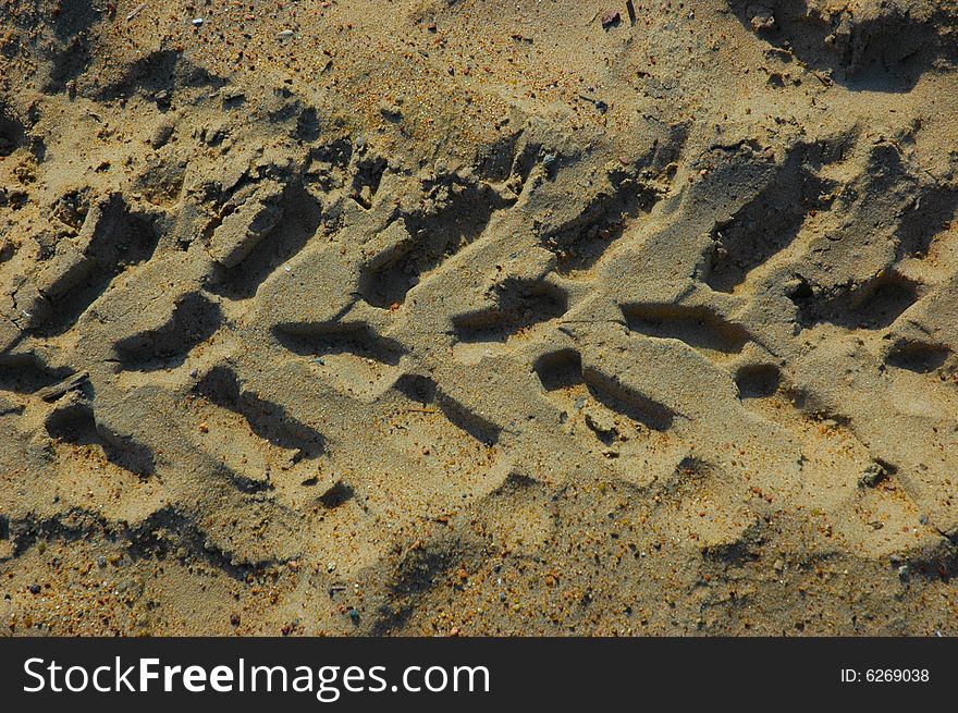 Track from a protector on sand. Track from a protector on sand