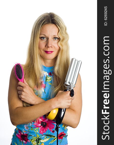 Long hair blonde woman with professional multi-styling set in her hands