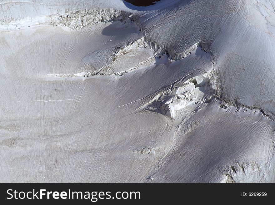 Part of a torn glacier on the mountain side. Part of a torn glacier on the mountain side