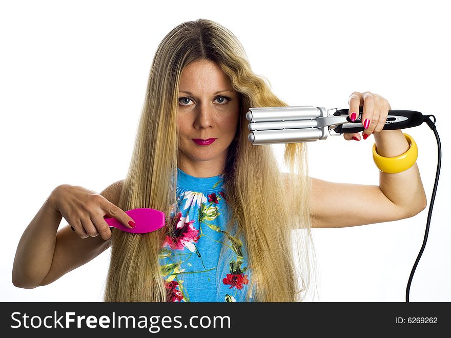 Long hair blonde woman with professional multi-styling set in her hands