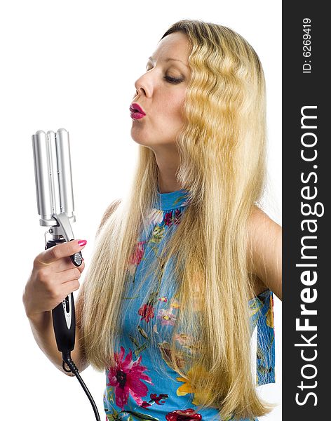 Long hair blonde woman with professional multi-styling set in her hand