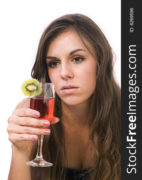 Girl sitting and drinking cocktail with kiwi