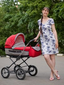 Woman With Baby Carriage Royalty Free Stock Photo