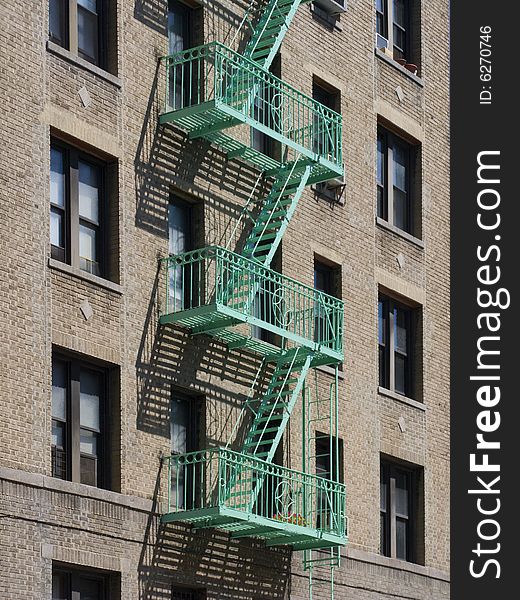 View from across street at fire escape on residential building. View from across street at fire escape on residential building