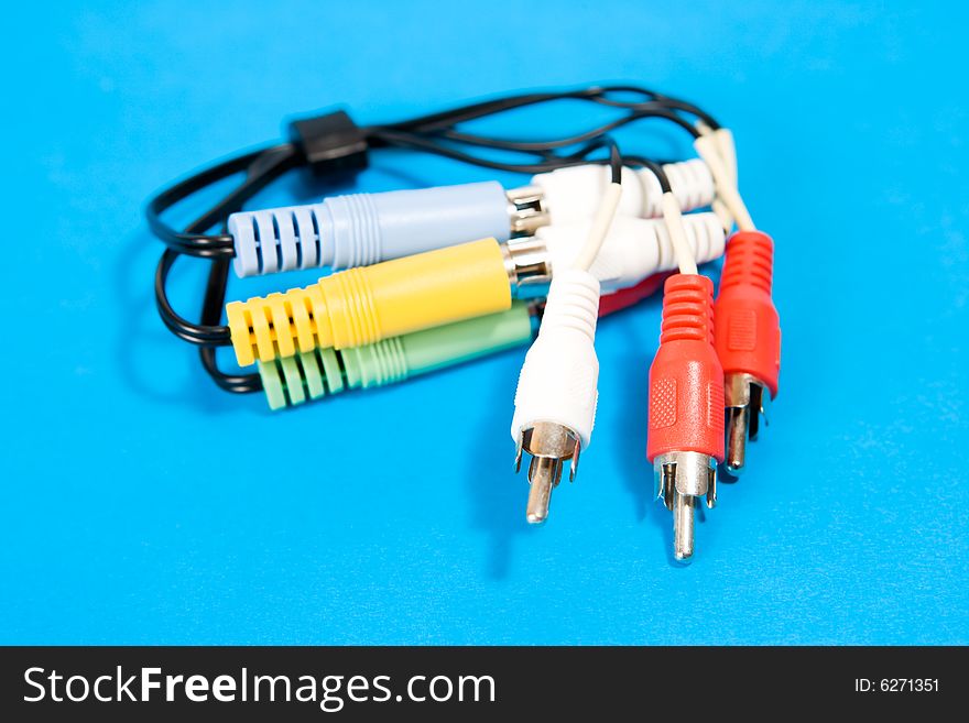 Cable with plugs and sockets on blue background