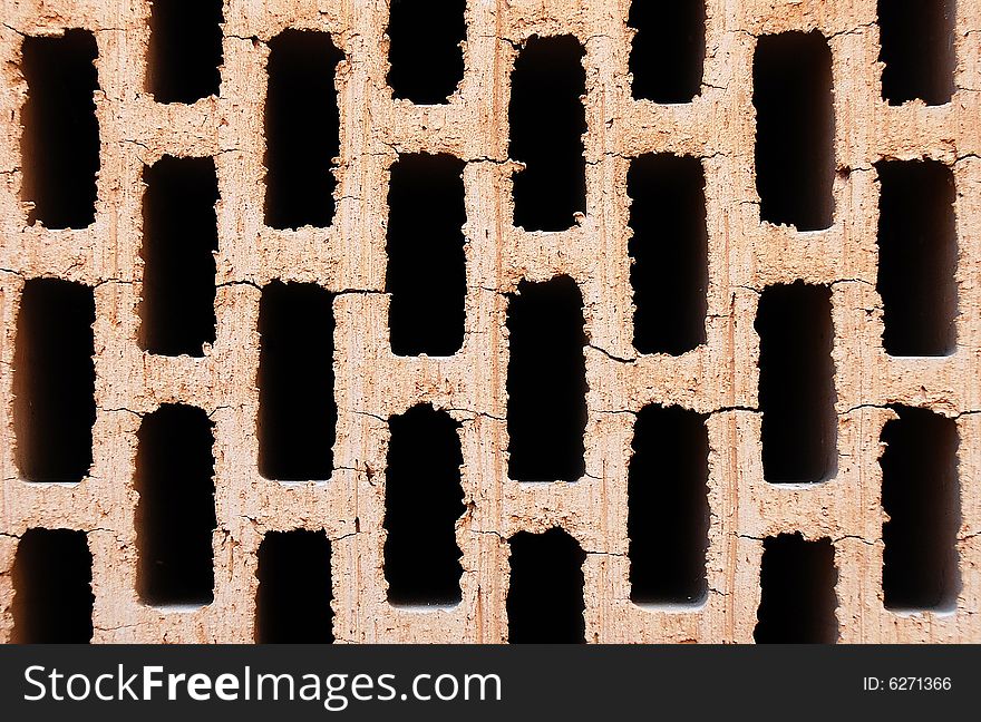 Detail of the surface of an ordinary brick used in construction. Detail of the surface of an ordinary brick used in construction