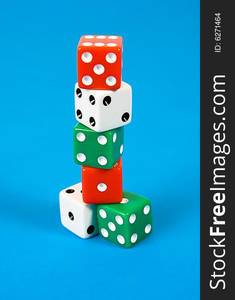 Stack of gaming dice on blue background