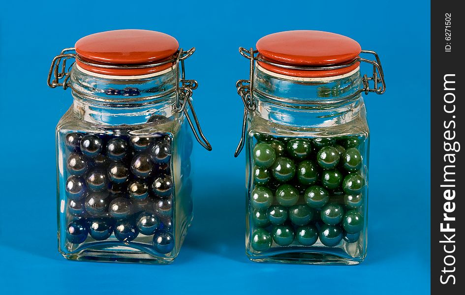 Two glass jars with red lids