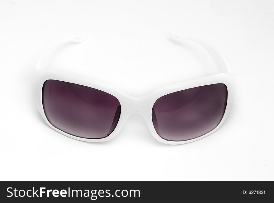 Cool white designer fashionable sunglasses against white background. Cool white designer fashionable sunglasses against white background