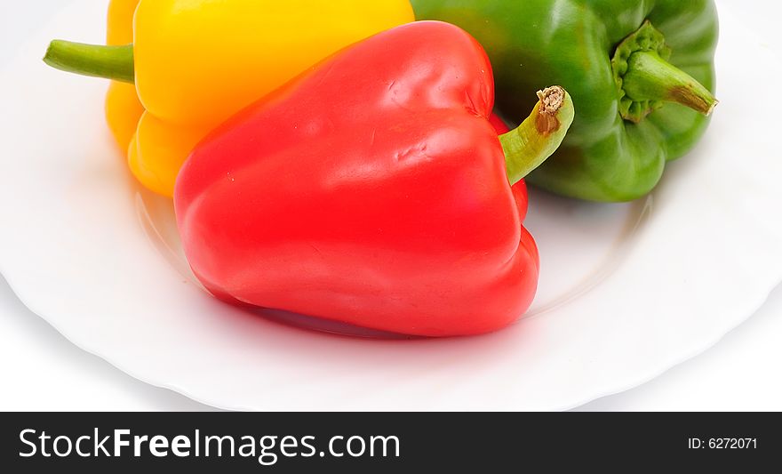 Three sweet peppers (paprika) on plate