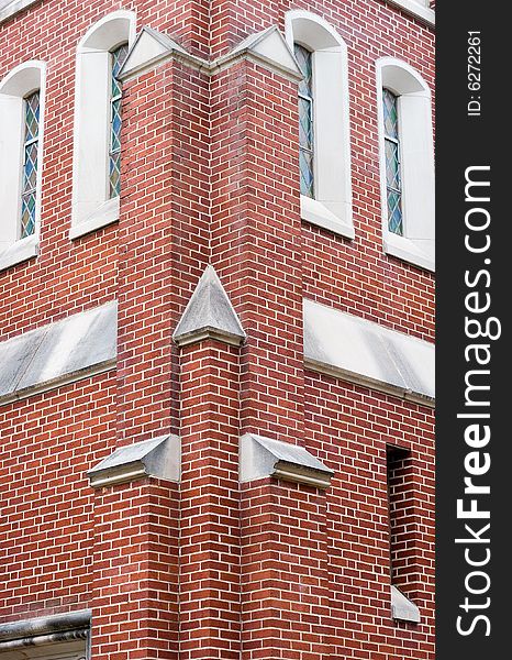 Corner detail of a brick church with windows. Corner detail of a brick church with windows