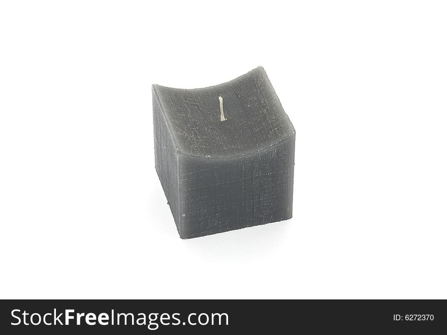 Gray wax candle with cubic shape. Gray wax candle with cubic shape.