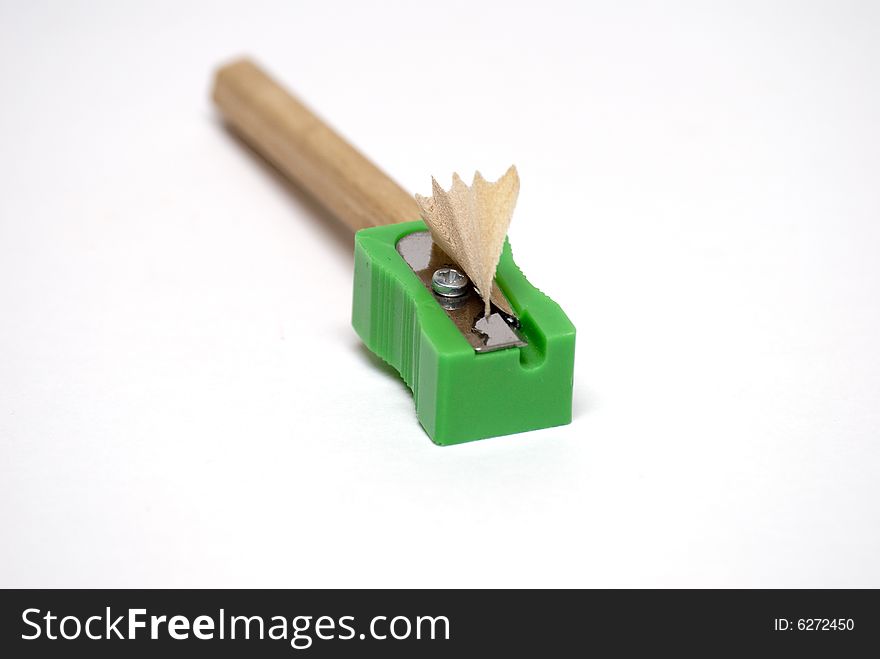 Pencil in a green plastic sharpener - Green concept. Pencil in a green plastic sharpener - Green concept.