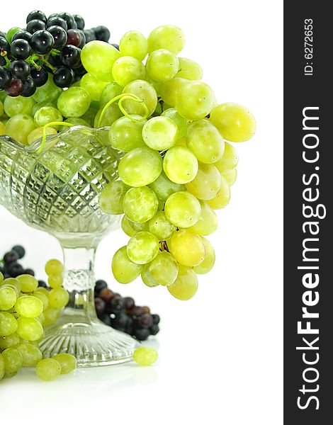 Cluster of green and blue grape isolated on white