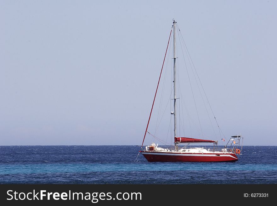 Sailing Yacht At Anchor In Bay Corsica