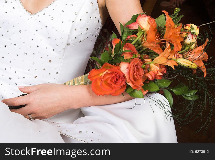 Bride holding a floral bouquet on her wedding day