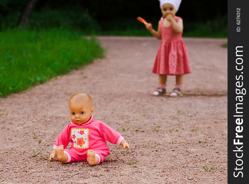 Pink doll left by small girl on the road. Pink doll left by small girl on the road