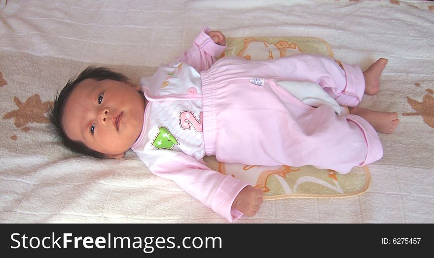 Adorable Baby on a bed