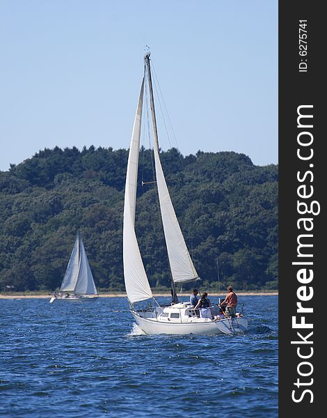 Sailboat beating into the wind on a windy day. Sailboat beating into the wind on a windy day.