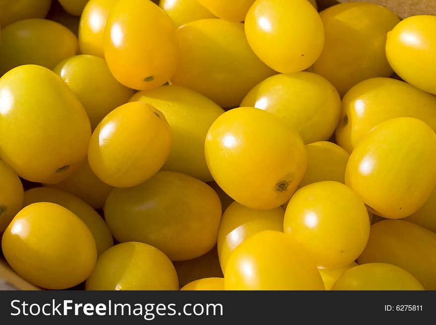 Group of yellow grape tomatoes. Horizontally framed photo. Group of yellow grape tomatoes. Horizontally framed photo.