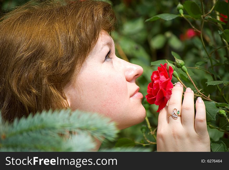 The Girl Smells A Rose Bud