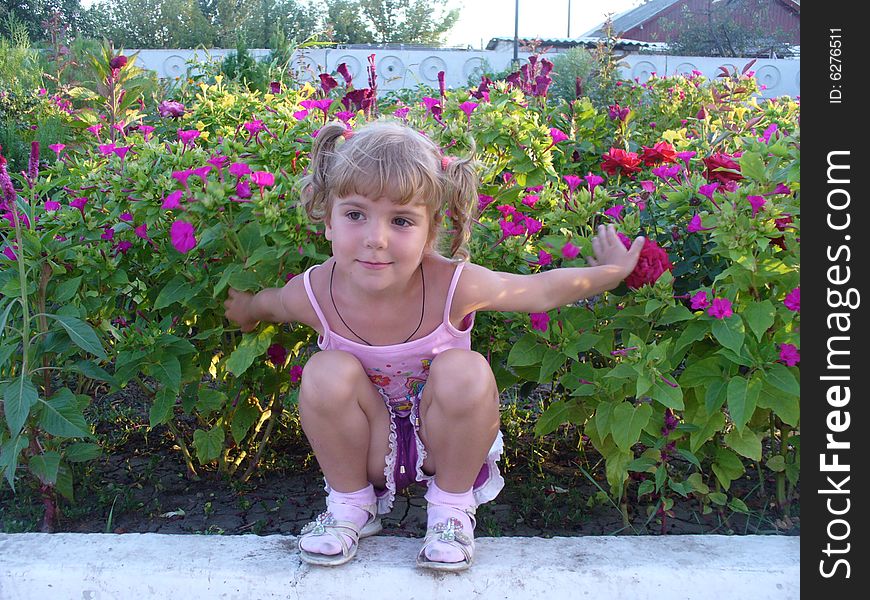 Child in flowers.Age of 4 years