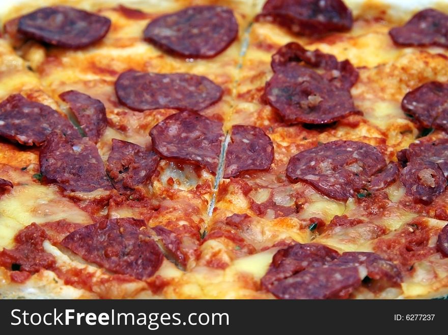 Close up shot of a pepperoni flavored pizza. Close up shot of a pepperoni flavored pizza