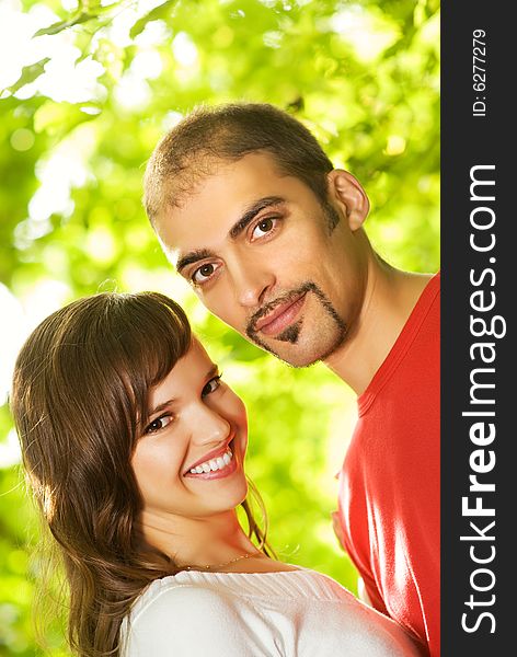 Young couple in love outdoors. Close-up portrait