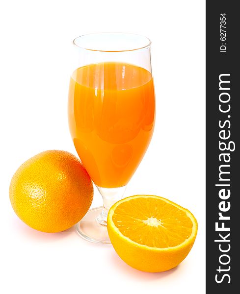 Orange Juice In Glass And Oranges.