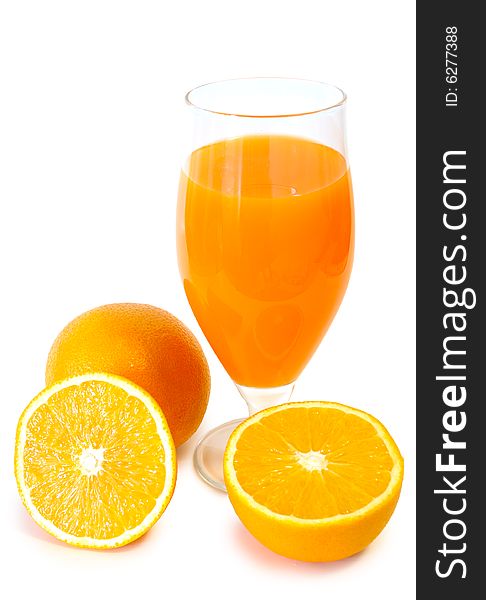 Orange Juice In Glass And Oranges.