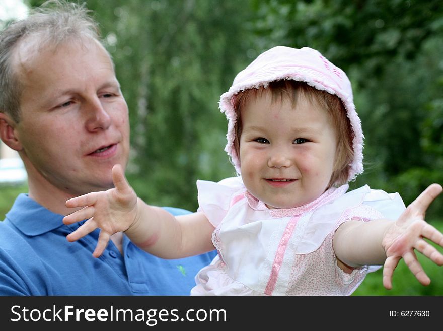 Little girl on her father's hands. Little girl on her father's hands