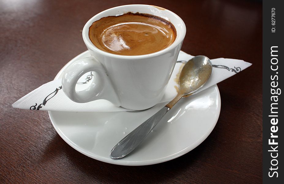Cup Of Espresso on brown table