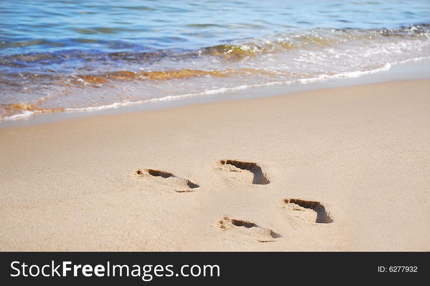 Footsteps on the beautiful beach. Footsteps on the beautiful beach