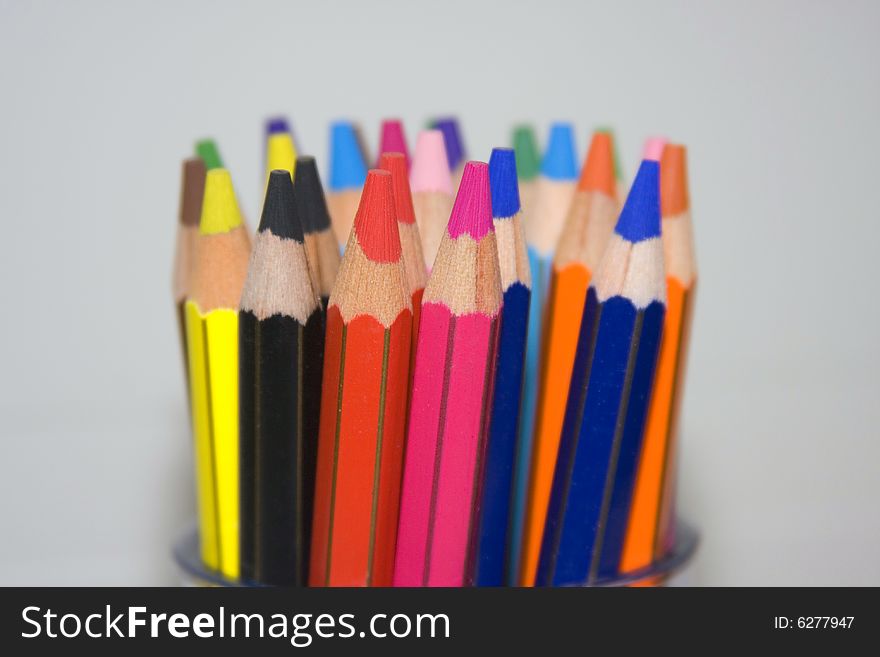 Color pencils in a pencil pot. Color pencils in a pencil pot.