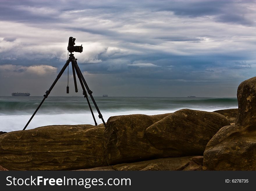 The hard working photographic equipment needed to capture rocks on the beach. The hard working photographic equipment needed to capture rocks on the beach