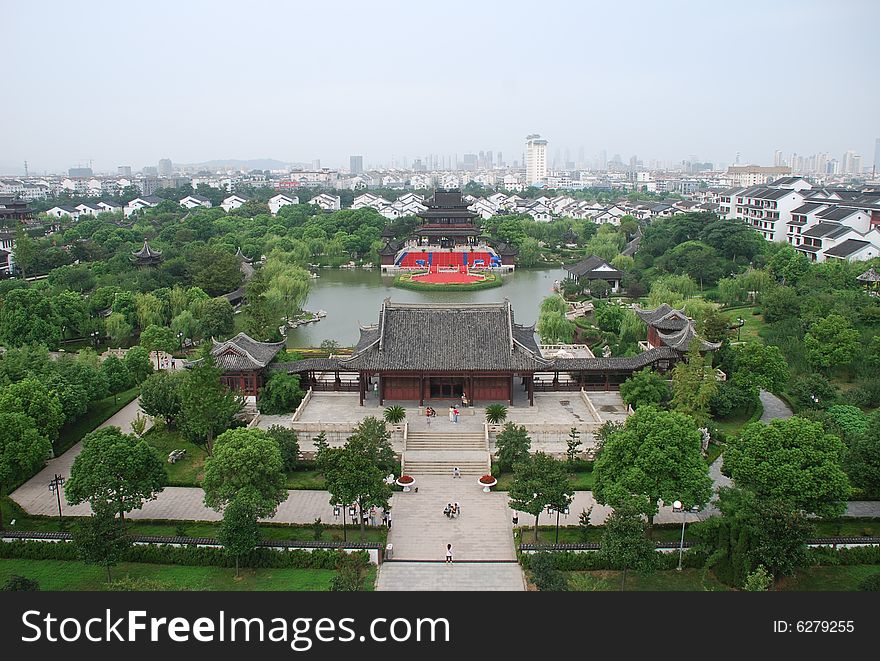 A Chinese ancient building in a park . A Chinese ancient building in a park .