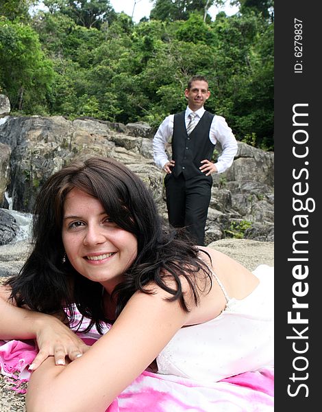 Happy bride and groom on top of a mountain.