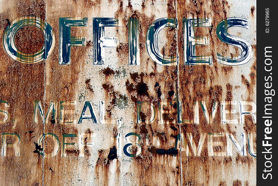 Rusting sign outside an abandoned flour mill