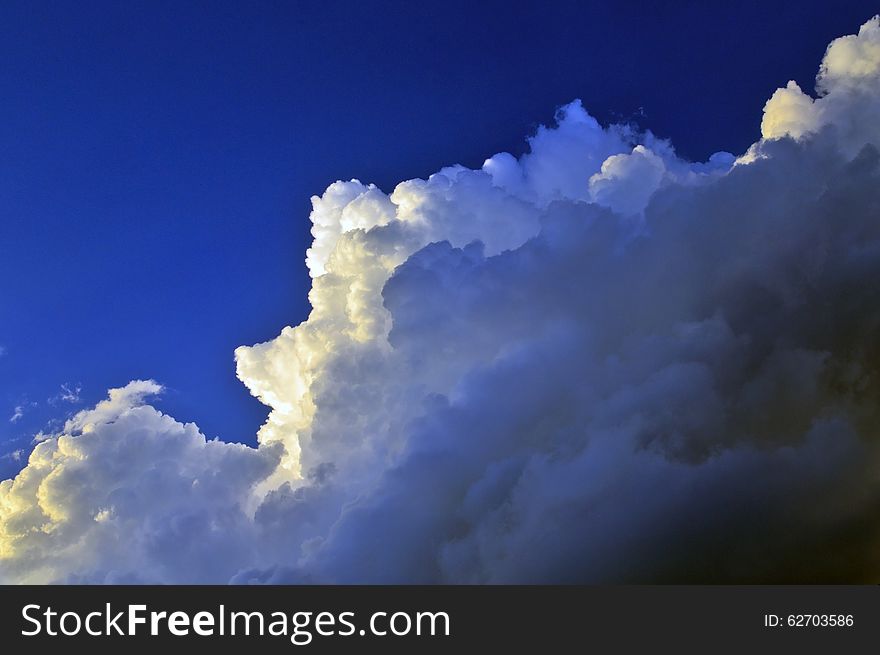 Sunlight highlighting storm clouds