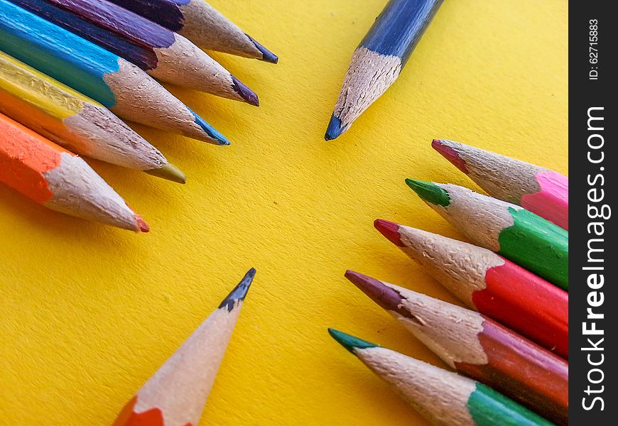 Picture with variety drawing crayon on yellow table. Picture with variety drawing crayon on yellow table