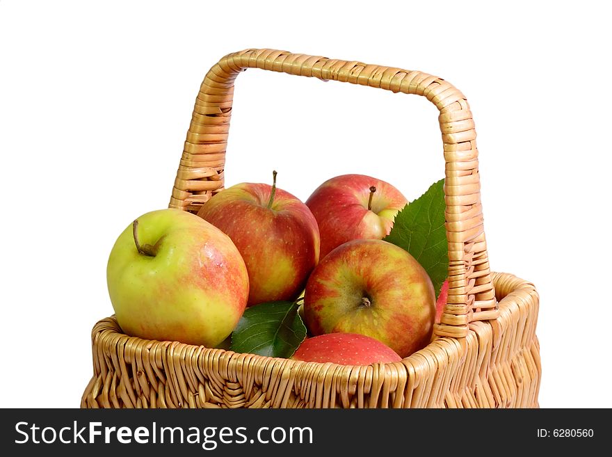 Basket with fresh apples on white background