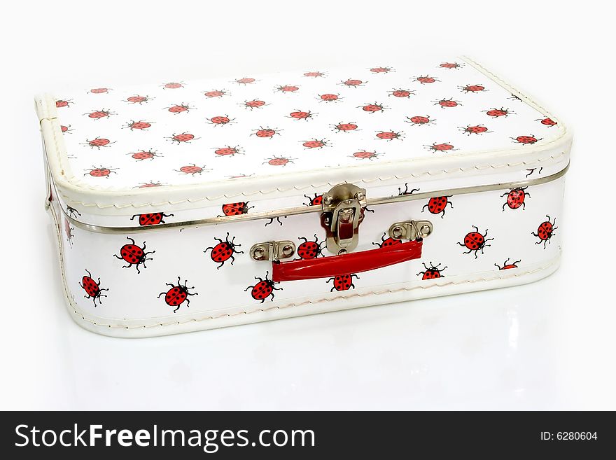 A childrens suitcase on bright background. A childrens suitcase on bright background