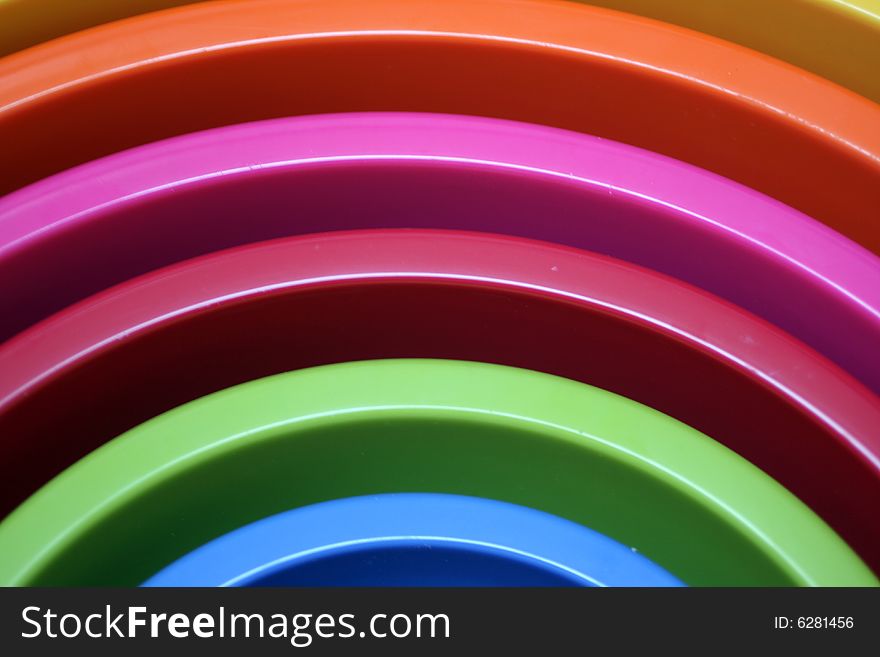 Stacked multi coloured plastic bowls