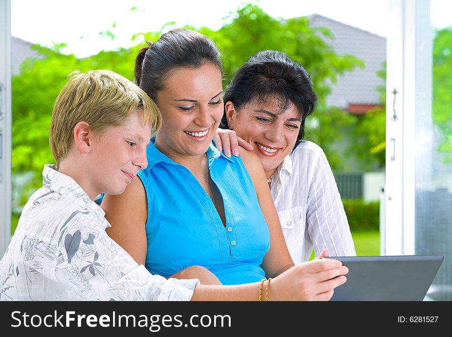 Portrait of happy family getting busy with laptop. Portrait of happy family getting busy with laptop