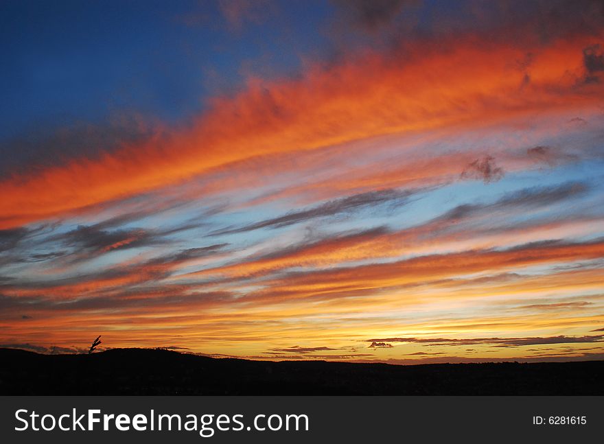 A beautiful vivid sunset in Stuttgart with milky sky