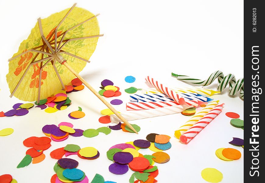 Detail of party still life, confetti, candles and umbrella. Detail of party still life, confetti, candles and umbrella