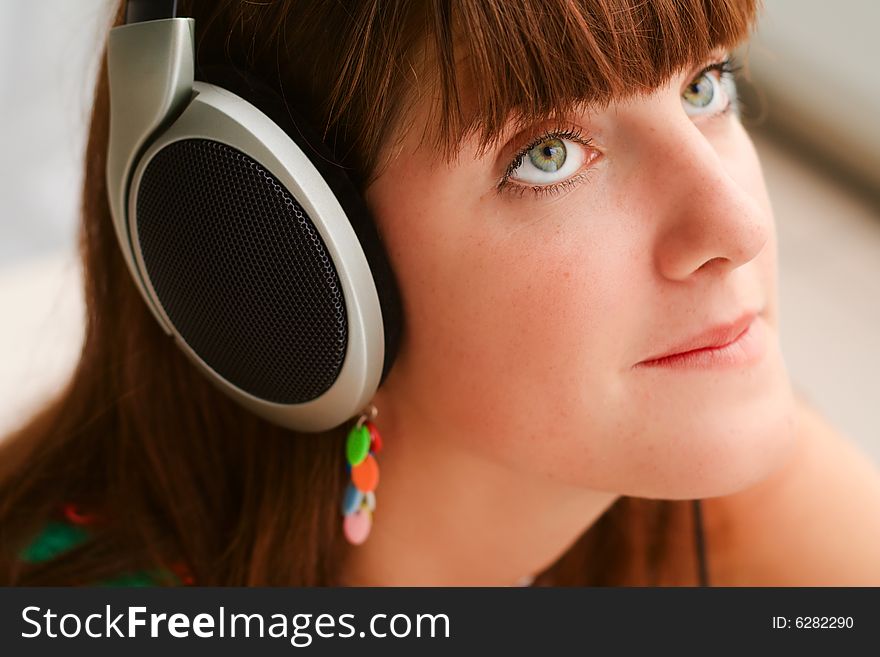 Pretty girl with big headphones portrait. Pretty girl with big headphones portrait