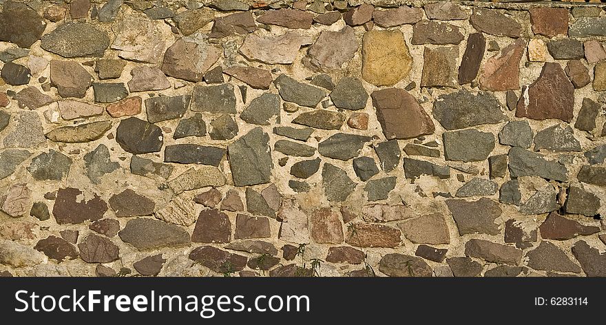 Stone wall background with ancient appearance